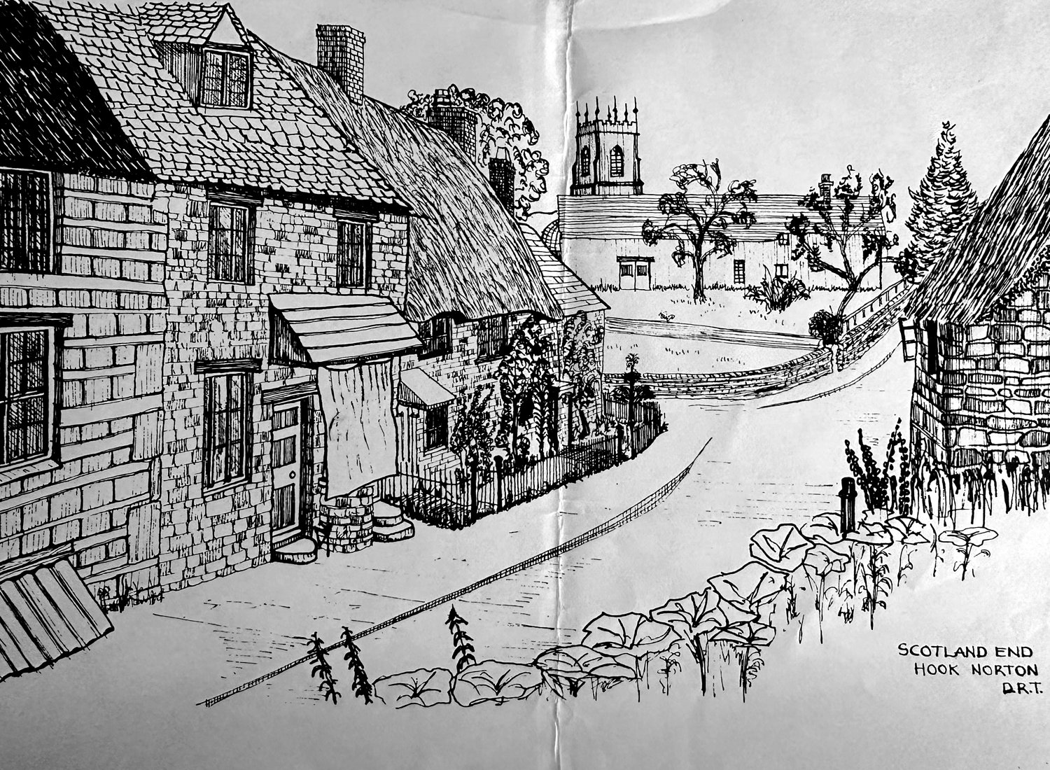 Pen-and-ink drawing of Scotland End, Hook Norton, with the parish church tower rising beyond the cottages